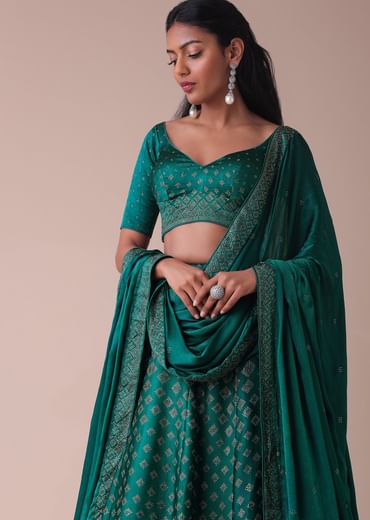 Deep Green Swarovski Embellished Lehenga In Wrinkle Satin