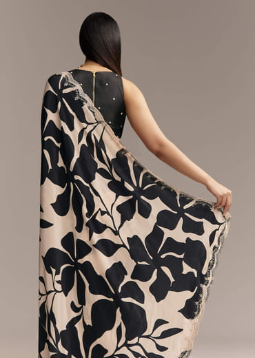 Beige Crepe Saree With Black Floral Print And Embellished Border