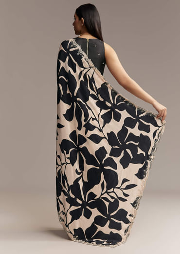 Beige Crepe Saree With Black Floral Print And Embellished Border