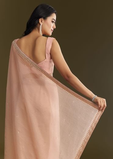 Beige Crushed Tissue Saree With Stone Embellishment And Glossy Finish