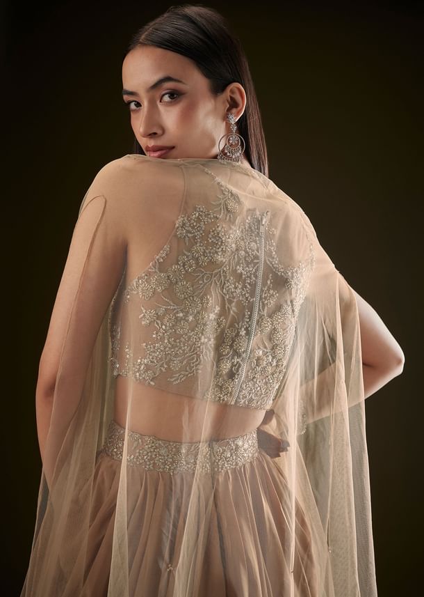 Beige Drape Dhoti Skirt With Embroidered Bustier And Long Cape Beige Drape Dhoti Skirt With Embroidered Bustier And Long Cape
