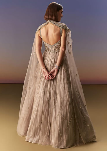Beige Gown With Shoulder Cape And Rich Vertical Embroidery