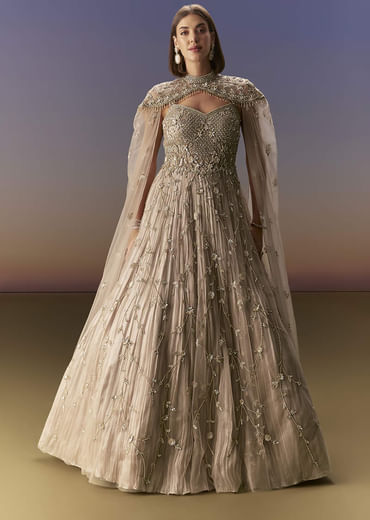 Beige Gown With Shoulder Cape And Rich Vertical Embroidery