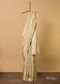 Beige South Dharmavaram Silk Saree With Woven Antique Motifs And Unstitched Blouse Fabric