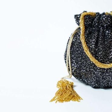 Black Potli Bag In Sequins Fabric With Cut Dana Tassels And Handle By Solasta