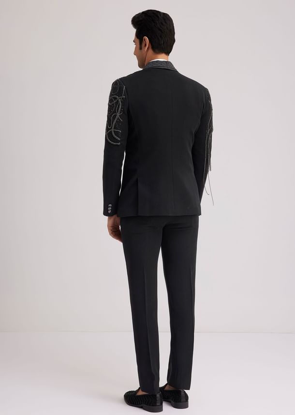 Black Suiting Tuxedo With Metallic Chain And Stone Work