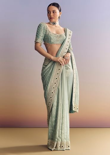 Blue Tissue Saree With Embroidered Border And Emerald Stone