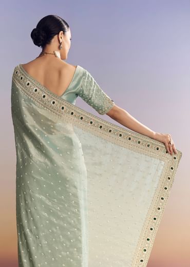 Blue Tissue Saree With Embroidered Border And Emerald Stone