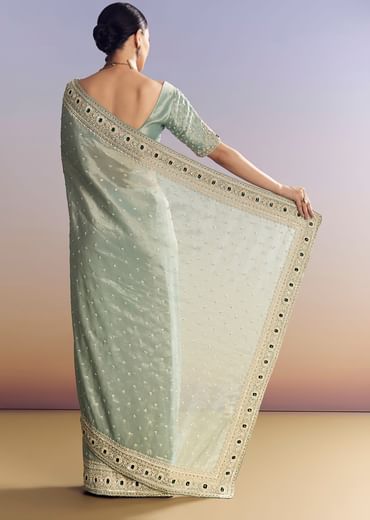 Blue Tissue Saree With Embroidered Border And Emerald Stone