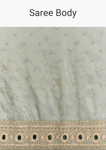 Blue Tissue Saree With Embroidered Border And Emerald Stone