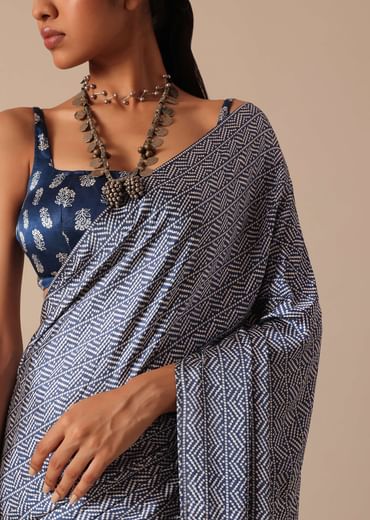 Blue Printed Saree In Satin With Tassel Detail And Unstitched Blouse Fabric