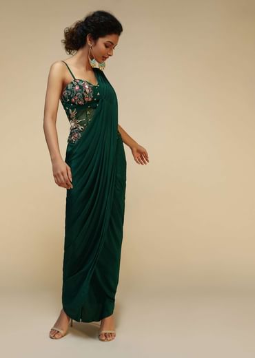 Bottle Green Saree Gown With A Crepe Cowl Drape And Sheer Embroidered Net Bodice With Colorful Resham Flowers