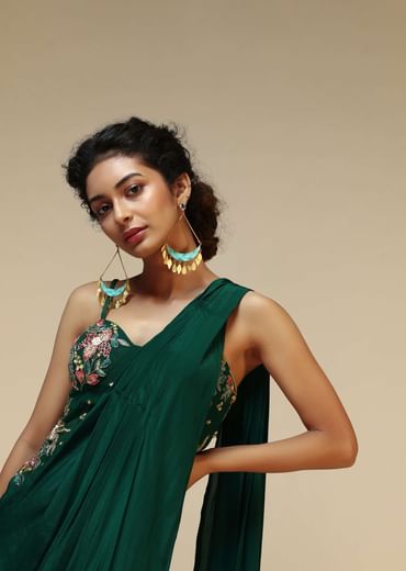 Bottle Green Saree Gown With A Crepe Cowl Drape And Sheer Embroidered Net Bodice With Colorful Resham Flowers
