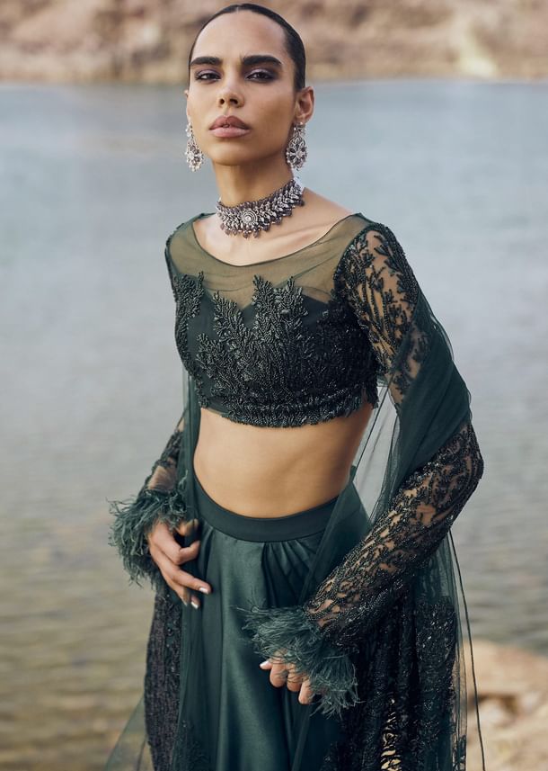 Bottle Green Feather Blouse With Draped Skirt And Dupatta Bottle Green Feather Blouse With Draped Skirt And Dupatta