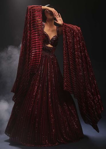 Burgundy Gown In Sequins Embellished Net With Attached Cape And Cut Dana Accented Front Cut Bodice