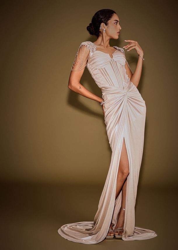 Champagne Drape Gown With Embroidered Shoulder Cape And Tassel Detailing