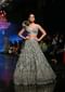 Fern Green Lehenga Choli In Net With Stone Hand Embroidered Floral Motifs And Fancy Origami Cones On The Shoulder