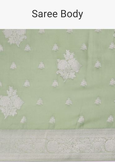 Forest shade green woven saree in Dola silk