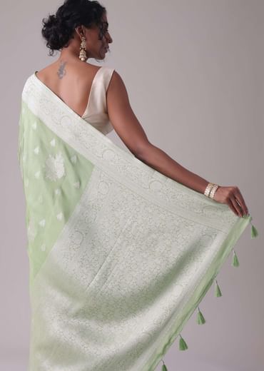 Forest shade green woven saree in Dola silk
