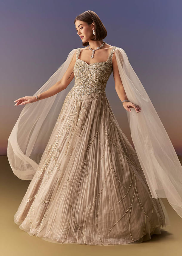 Gold Gown With Pleated Panels And Dramatic Cape Gold Gown With Pleated Panels And Dramatic Cape