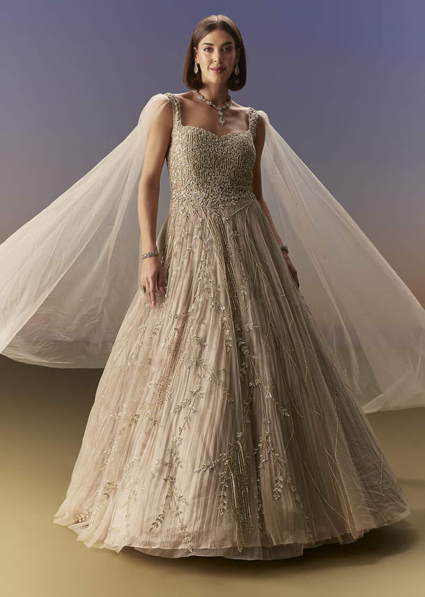 Gold Gown With Pleated Panels And Dramatic Cape Gold Gown With Pleated Panels And Dramatic Cape