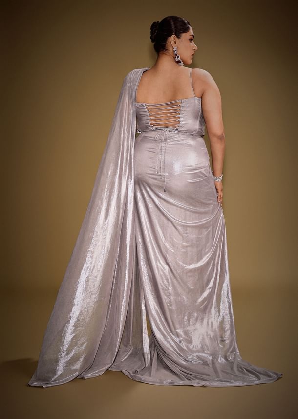 Gold One Shoulder Drape Gown With Embroidered Floral Brooch And Trail