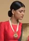 Gold Plated Kundan Necklace And Earrings Set With Pink Stone Studded Floral Motif And Strings Of White Beads Online - Kalki Fashion