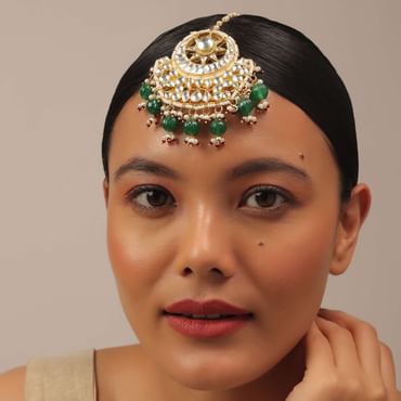 Gold Finish Kundan Floral Maangtika With Synthetic Emerald Stones And Beads