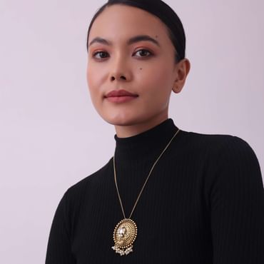 Gold Finish Long Necklace Embedded With A Small Motif