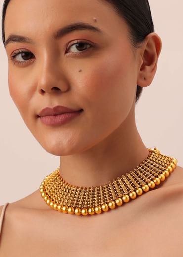 Gold Tone Temple Necklace With Layered Earrings