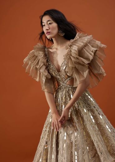 Gold Toned Kalki Gown With Ruffle Sleeves And Embroidery - NOOR 2022