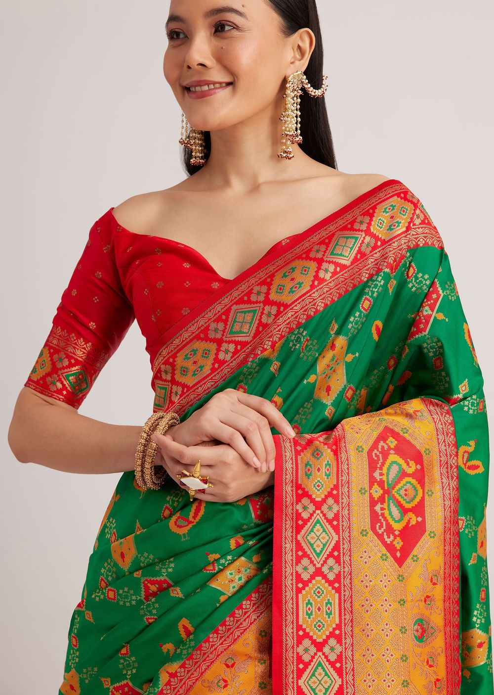 Green Silk Woven Ikat Motif Saree With Constrat Pallu