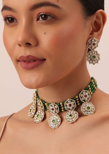 Green Temple Choker Set With Floral Motifs And Meenakari Detail