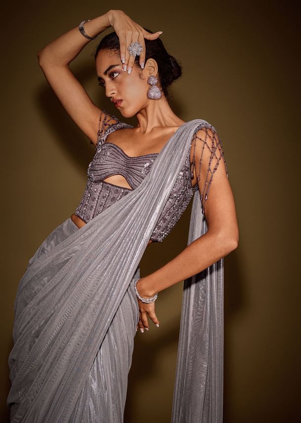 Grey Embellished Corset Blouse With Draped Saree And Tassel Detailing Grey Embellished Corset Blouse With Draped Saree And Tassel Detailing