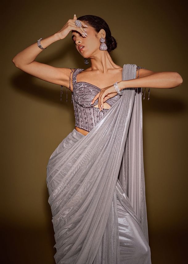 Grey Embellished Corset Blouse With Draped Saree And Tassel Detailing Grey Embellished Corset Blouse With Draped Saree And Tassel Detailing
