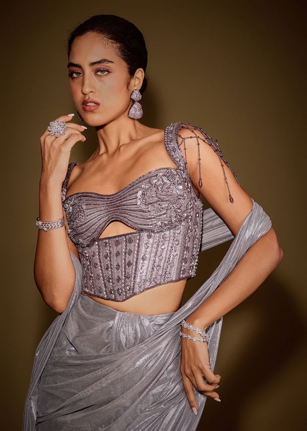 Grey Embellished Corset Blouse With Draped Saree And Tassel Detailing Grey Embellished Corset Blouse With Draped Saree And Tassel Detailing