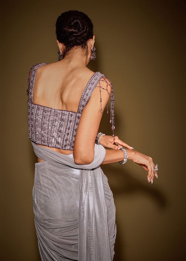 Grey Embellished Corset Blouse With Draped Saree And Tassel Detailing Grey Embellished Corset Blouse With Draped Saree And Tassel Detailing