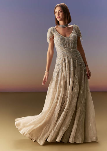 Grey Gown With Draped Cap Sleeves And Flowing Embroidered Flare