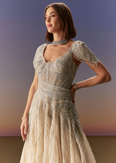 Grey Gown With Draped Cap Sleeves And Flowing Embroidered Flare