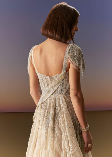 Grey Gown With Draped Cap Sleeves And Flowing Embroidered Flare