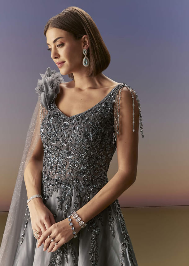 Grey Sleeveless Gown With Soft Net Trail And Shimmer Grey Sleeveless Gown With Soft Net Trail And Shimmer