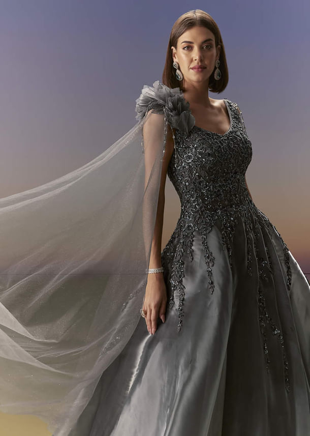 Grey Sleeveless Gown With Soft Net Trail And Shimmer Grey Sleeveless Gown With Soft Net Trail And Shimmer