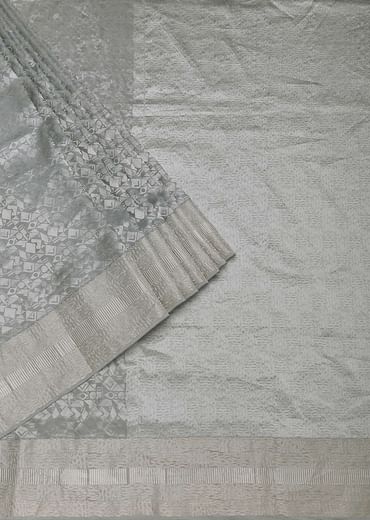 Grey South Silk Saree With Abstract Zari Border And Unstitched Blouse Fabric