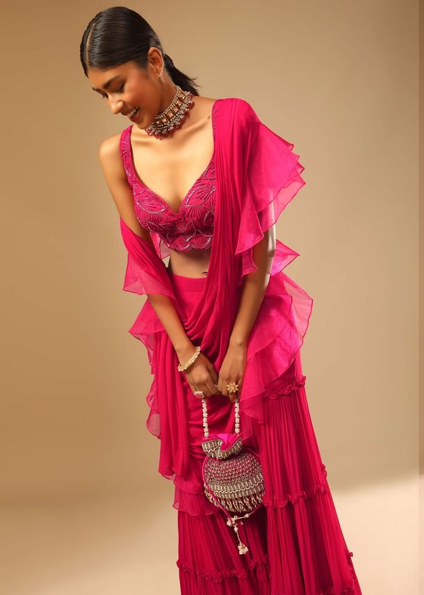 Hot Pink Crop Top Sharara Suit With An Attached Ruffle Draped And An Hand Embroidered Leaf Motifs