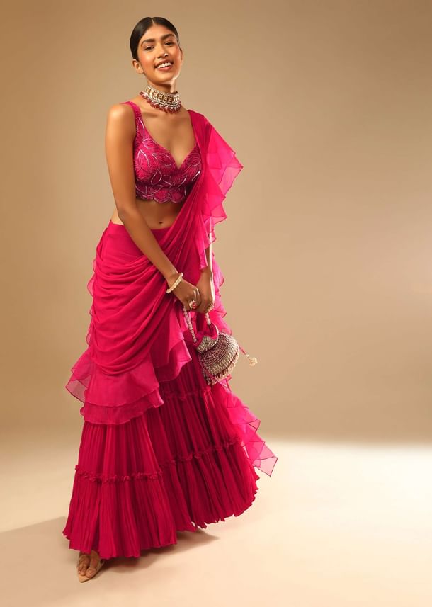 Hot Pink Crop Top Sharara Suit With An Attached Ruffle Draped And An Hand Embroidered Leaf Motifs
