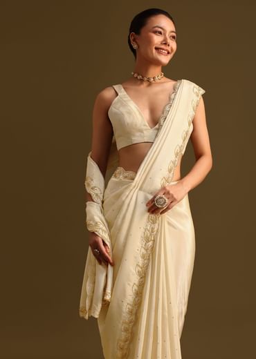 Ivory Tissue Saree With Cutdana Embroidered Border and Unstitched Blouse