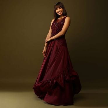 Maroon Gown With Ruched Bodice And Fancy Ruffled Hem