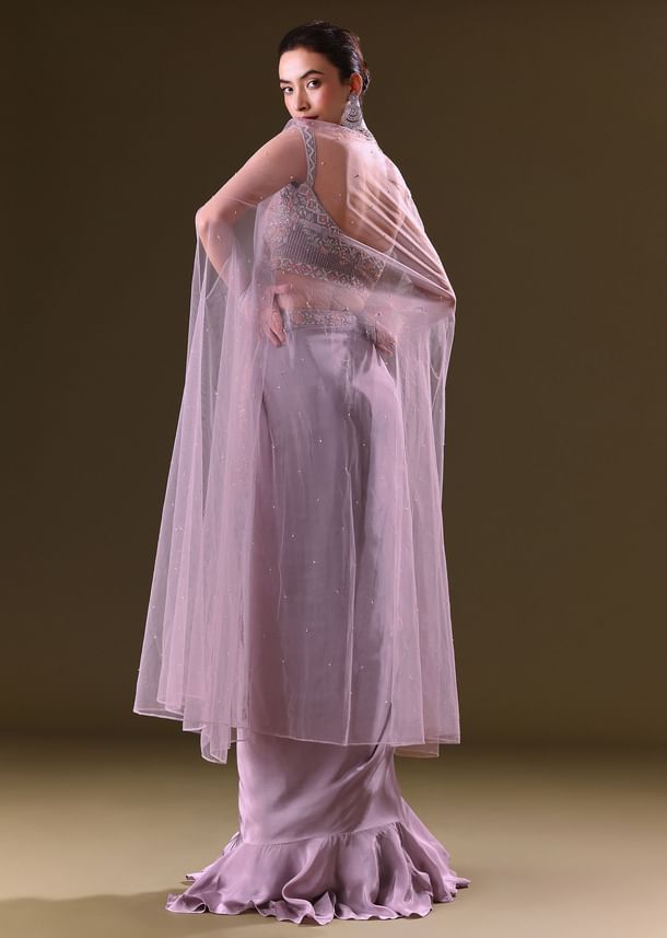 Mauve Ruffled Drape Skirt With Embroidered Blouse And Net Cape