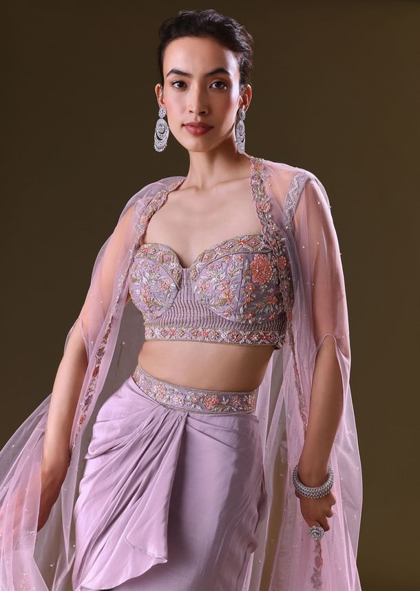 Mauve Ruffled Drape Skirt With Embroidered Blouse And Net Cape