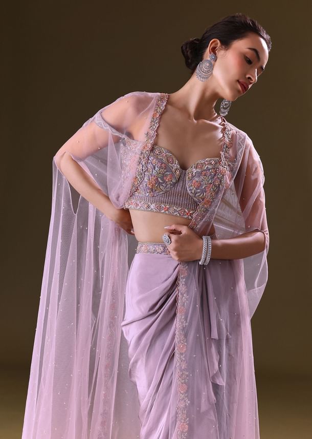 Mauve Ruffled Drape Skirt With Embroidered Blouse And Net Cape